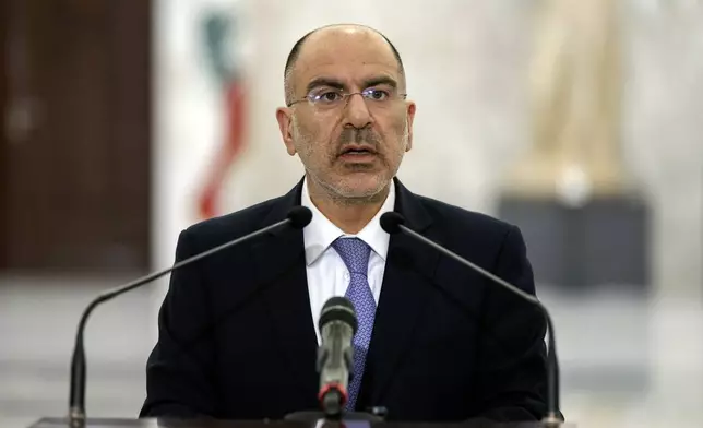 Antoine Shoukeir, the presidency's director general, announces that Nawaf Salam, a prominent diplomat and jurist is now prime minister-designate at the presidential palace in Baabda, east of Beirut, Lebanon, Monday, Jan. 13, 2025. (AP Photo/Bilal Hussein)