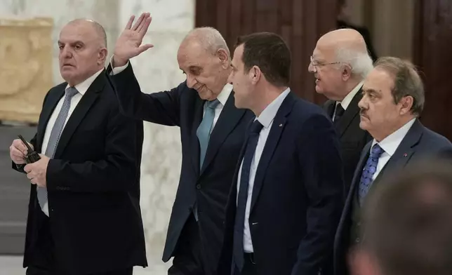Parliament Speaker Nabih Berri, second left, waves to journalists after his meeting with Lebanese President Joseph Aoun at the presidential palace in Baabda, east of Beirut, Lebanon, Monday, Jan. 13, 2025. (AP Photo/Bilal Hussein)