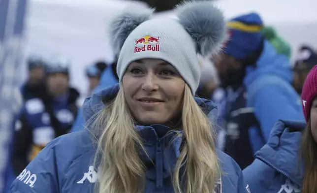 Alpine ski great United States Lindsey Vonn watches the 10km women's mass start race of the Tour de Ski cross country, in Val di Fiemme, Italy, Sunday, Jan. 5, 2025. (AP Photo/Alessandro Trovati)