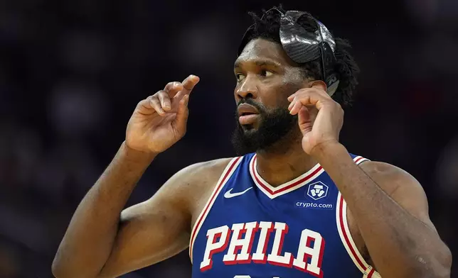 Philadelphia 76ers center Joel Embiid watches during the first half of an NBA basketball game against the Golden State Warriors, Thursday, Jan. 2, 2025, in San Francisco. (AP Photo/Godofredo A. Vásquez)