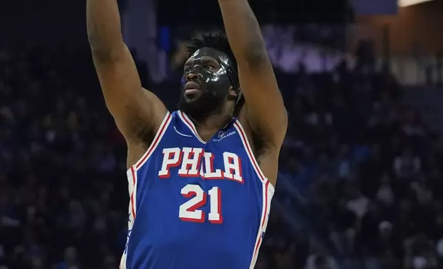 Philadelphia 76ers center Joel Embiid shoots during the first half of an NBA basketball game against the Golden State Warriors, Thursday, Jan. 2, 2025, in San Francisco. (AP Photo/Godofredo A. Vásquez)