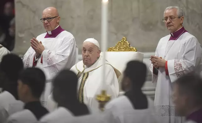 Pope Francis presides over an Epiphany mass in St.Peter's Basilica, at the Vatican, Monday, Jan. 6, 2025. (AP Photo/Alessandra Tarantino)