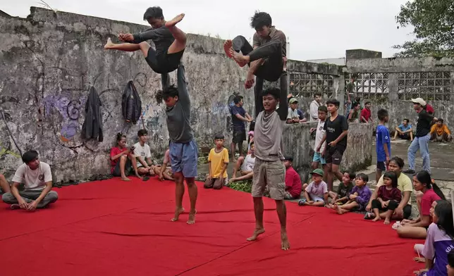 Members of dragon dance club Naga Merah Putih (Red White Dragon) which is named after Indonesian national colors, practice in Bogor, West Java, Indonesia, Wednesday, Jan. 22, 2025. (AP Photo/Dita Alangkara)