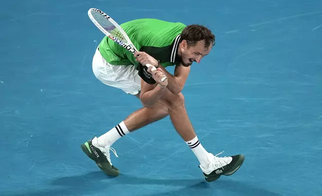 FILE - Daniil Medvedev of Russia hits a backhand to Jannik Sinner of Italy during the men's singles final at the Australian Open tennis championships at Melbourne Park, in Melbourne, Australia, Sunday, Jan. 28, 2024. (AP Photo/Louise Delmotte, File)