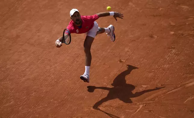 FILE - Serbia's Novak Djokovic returns the ball Spain's Carlos Alcaraz during the men's singles tennis final at the Roland Garros stadium during the 2024 Summer Olympics, Sunday, Aug. 4, 2024, in Paris, France. (AP Photo/Andy Wong, File)