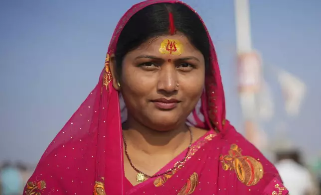 A Hindu devotee wears a sacred mark on her forehead at the confluence of the Ganges, the Yamuna, and the Saraswati rivers during the 45-day-long Maha Kumbh festival in Prayagraj, India, Tuesday, Jan. 28, 2025. (AP Photo/Deepak Sharma)
