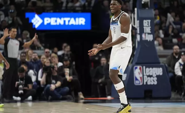 Minnesota Timberwolves guard Anthony Edwards (5) reacts after not receiving a foul call during the first half of an NBA basketball game against the Boston Celtics, Thursday, Jan. 2, 2025, in Minneapolis. (AP Photo/Abbie Parr)