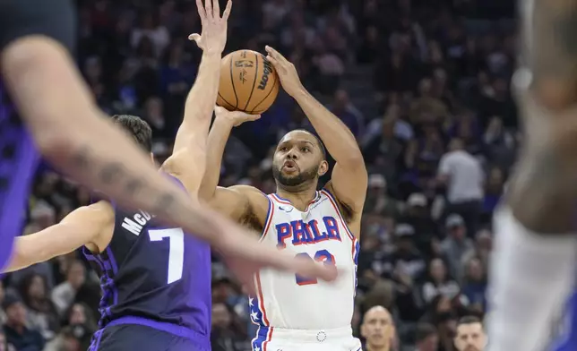 Philadelphia 76ers guard Eric Gordon shoots over Sacramento Kings forward Doug McDermott (7) during the first half of an NBA basketball game in Sacramento, Calif., Wednesday, Jan. 1, 2025. (AP Photo/Randall Benton)