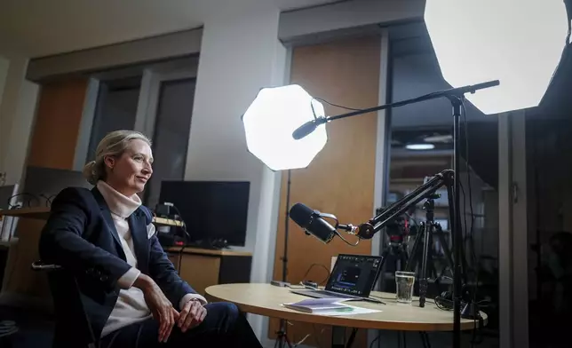 Alice Weidel, parliamentary group leader, party chairwoman and candidate for chancellor of the AfD, prepares for a live X interview with U.S. billionaire Elon Musk in her office in the Jakob Kaiser House in Berlin, on Thursday, Jan. 9, 2025. (Kay Nietfeld/Pool Photo via AP)