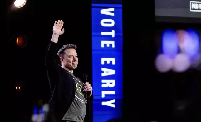 FILE - Tesla and SpaceX CEO Elon Musk gestures as he speaks at Life Center Church in Harrisburg, Pa., on Oct. 19, 2024. (Sean Simmers/The Patriot-News via AP, File)