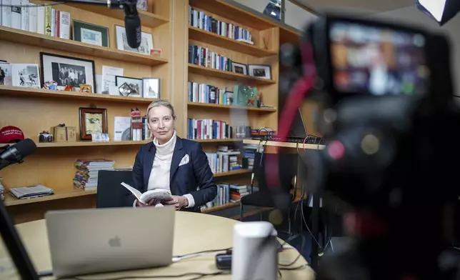 Alice Weidel, parliamentary group leader, party chairwoman and candidate for chancellor of the AfD, prepares for a live X interview with U.S. billionaire Elon Musk in her office in the Jakob Kaiser House in Berlin, on Thursday, Jan. 9, 2025. (Kay Nietfeld/Pool Photo via AP)