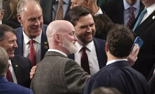 Vice President-elect JD Vance is congratulated after a joint session of Congress confirmed the Electoral College votes, affirming President-elect Donald Trump's victory in the presidential election, Monday, Jan. 6, 2025, at the U.S. Capitol in Washington. (AP Photo/Matt Rourke)