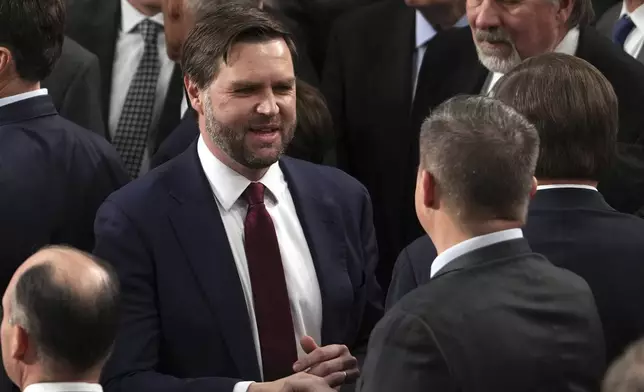 Vice President-elect JD Vance is congratulated after a joint session of Congress confirmed the Electoral College votes, affirming President-elect Donald Trump's victory in the presidential election, Monday, Jan. 6, 2025, at the U.S. Capitol in Washington. (AP Photo/Matt Rourke)
