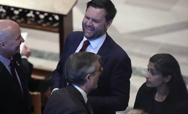 Vice President-elect JD Vance and his wife Usha Vance arrive before the state funeral for former President Jimmy Carter at Washington National Cathedral in Washington, Thursday, Jan. 9, 2025. (AP Photo/Jacquelyn Martin)