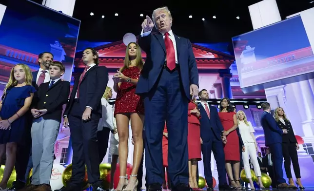 FILE - Republican presidential candidate former President Donald Trump stands on stage with former first lady Melania Trump, family members and Republican vice presidential candidate Sen. JD Vance, R-Ohio, and his wife, Usha Chilukuri Vance, during the 2024 Republican National Convention at the Fiserv Forum on July 18, 2024, in Milwaukee. (AP Photo/Carolyn Kaster, File)