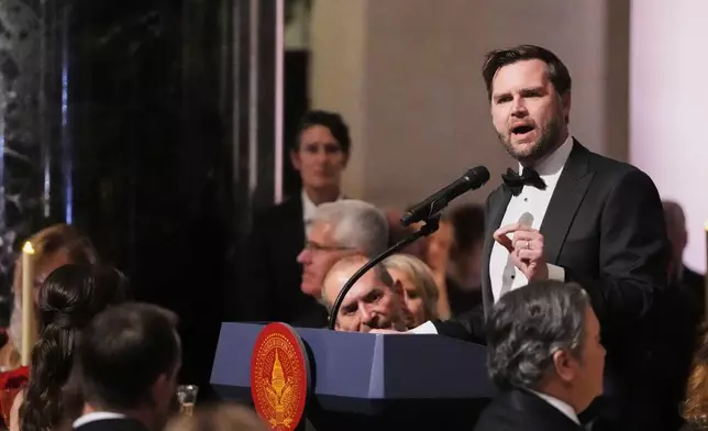 Vice President-elect JD Vance speaks during a dinner event at the National Gallery of Art in Washington, Saturday, Jan. 18, 2025. (AP Photo/Mark Schiefelbein)
