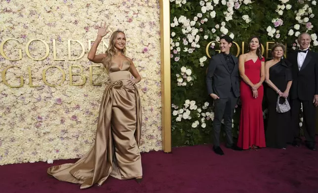 Nikki Glaser, from left, Matt Green, Lauren Green, Julie Glaser, and Edward Glaser arrive at the 82nd Golden Globes on Sunday, Jan. 5, 2025, at the Beverly Hilton in Beverly Hills, Calif. (Photo by Jordan Strauss/Invision/AP)