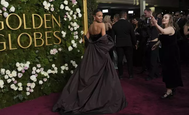 Zoe Saldana arrives at the 82nd Golden Globes on Sunday, Jan. 5, 2025, at the Beverly Hilton in Beverly Hills, Calif. (Photo by Jordan Strauss/Invision/AP)