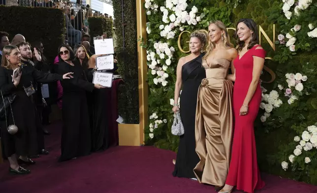 Julie Glaser, from left, Nikki Glaser, and Lauren Green arrive at the 82nd Golden Globes on Sunday, Jan. 5, 2025, at the Beverly Hilton in Beverly Hills, Calif. (Photo by Jordan Strauss/Invision/AP)