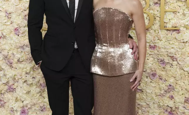 Dax Shepard, left, and Kristen Bell arrive at the 82nd Golden Globes on Sunday, Jan. 5, 2025, at the Beverly Hilton in Beverly Hills, Calif. (Photo by Jordan Strauss/Invision/AP)