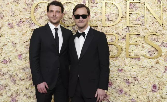 Charles Gagne, left, and Michael Pollack arrive at the 82nd Golden Globes on Sunday, Jan. 5, 2025, at the Beverly Hilton in Beverly Hills, Calif. (Photo by Jordan Strauss/Invision/AP)