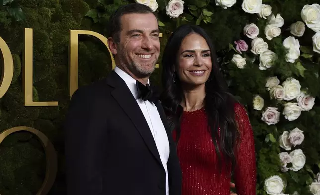 Mason Morfit, left, and Jordana Brewster arrive at the 82nd Golden Globes on Sunday, Jan. 5, 2025, at the Beverly Hilton in Beverly Hills, Calif. (Photo by Jordan Strauss/Invision/AP)