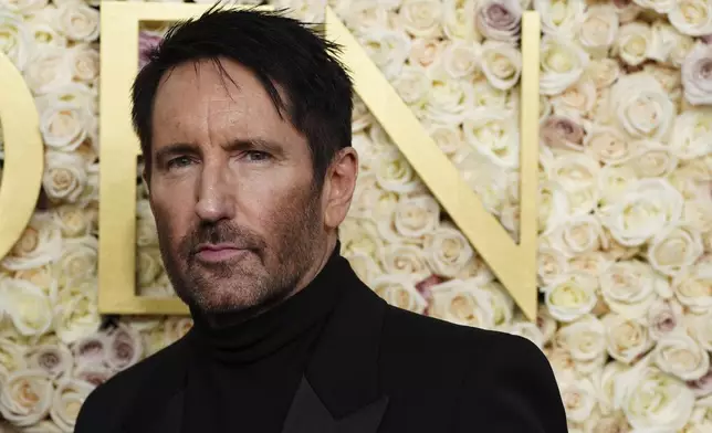 Trent Reznor arrives at the 82nd Golden Globes on Sunday, Jan. 5, 2025, at the Beverly Hilton in Beverly Hills, Calif. (Photo by Jordan Strauss/Invision/AP)