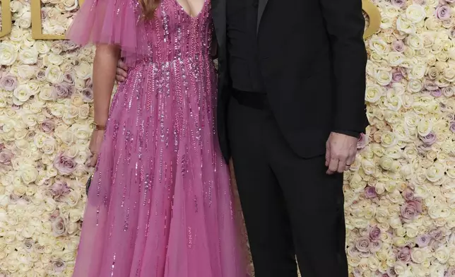 Trilby Glover, left, and Ian Brennan arrive at the 82nd Golden Globes on Sunday, Jan. 5, 2025, at the Beverly Hilton in Beverly Hills, Calif. (Photo by Jordan Strauss/Invision/AP)