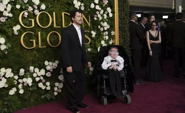 Ramy Youssef, left, and Steve Way arrive at the 82nd Golden Globes on Sunday, Jan. 5, 2025, at the Beverly Hilton in Beverly Hills, Calif. (Photo by Jordan Strauss/Invision/AP)