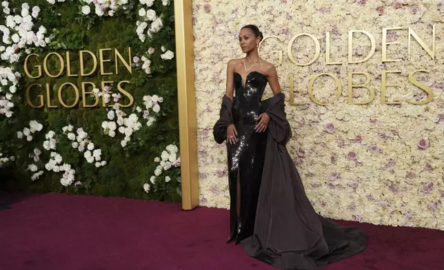 Zoe Saldana arrives at the 82nd Golden Globes on Sunday, Jan. 5, 2025, at the Beverly Hilton in Beverly Hills, Calif. (Photo by Jordan Strauss/Invision/AP)