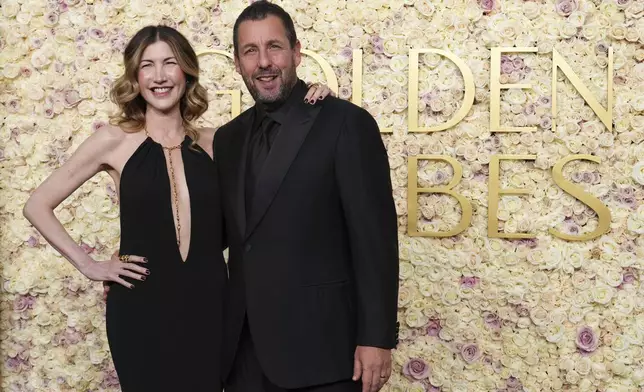 Jackie Sandler, left, and Adam Sandler arrive at the 82nd Golden Globes on Sunday, Jan. 5, 2025, at the Beverly Hilton in Beverly Hills, Calif. (Photo by Jordan Strauss/Invision/AP)