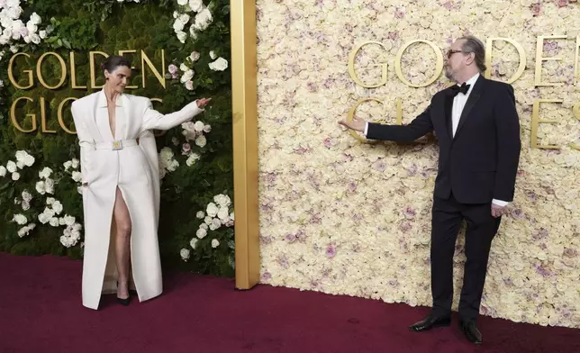 Keri Russell, left, and Gary Oldman arrive at the 82nd Golden Globes on Sunday, Jan. 5, 2025, at the Beverly Hilton in Beverly Hills, Calif. (Photo by Jordan Strauss/Invision/AP)