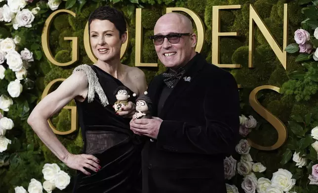 Liz Kearney, left, and Adam Elliot arrive at the 82nd Golden Globes on Sunday, Jan. 5, 2025, at the Beverly Hilton in Beverly Hills, Calif. (Photo by Jordan Strauss/Invision/AP)