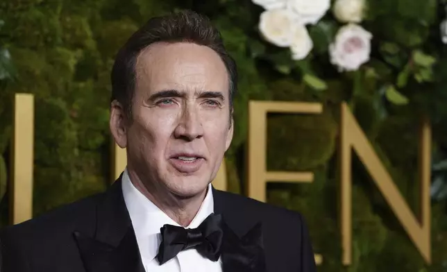 Nicolas Cage arrives at the 82nd Golden Globes on Sunday, Jan. 5, 2025, at the Beverly Hilton in Beverly Hills, Calif. (Photo by Jordan Strauss/Invision/AP)