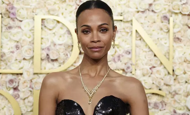 Zoe Saldana arrives at the 82nd Golden Globes on Sunday, Jan. 5, 2025, at the Beverly Hilton in Beverly Hills, Calif. (Photo by Jordan Strauss/Invision/AP)