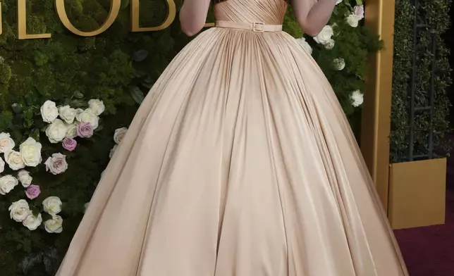 Elle Fanning arrives at the 82nd Golden Globes on Sunday, Jan. 5, 2025, at the Beverly Hilton in Beverly Hills, Calif. (Photo by Jordan Strauss/Invision/AP)