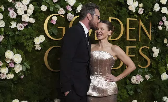 Dax Shepard, left, and Kristen Bell arrive at the 82nd Golden Globes on Sunday, Jan. 5, 2025, at the Beverly Hilton in Beverly Hills, Calif. (Photo by Jordan Strauss/Invision/AP)