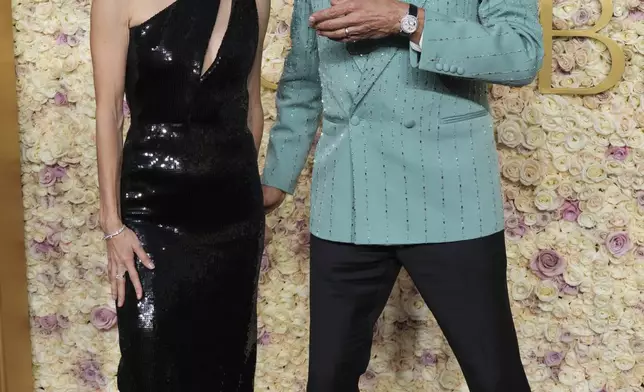 Emilie Livingston, left, and Jeff Goldblum arrive at the 82nd Golden Globes on Sunday, Jan. 5, 2025, at the Beverly Hilton in Beverly Hills, Calif. (Photo by Jordan Strauss/Invision/AP)