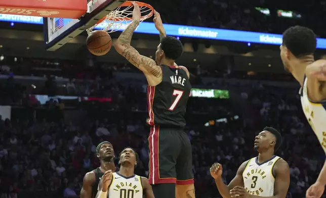 Miami Heat center Kel'el Ware (7) dunks during the first half of an NBA basketball game against the Indiana Pacers Thursday, Jan. 2, 2025, in Miami. (AP Photo/Lynne Sladky)