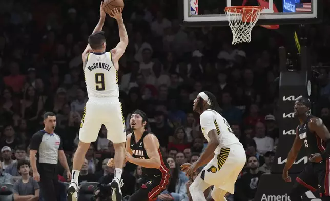 Indiana Pacers guard T.J. McConnell (9) shoots during the first half of an NBA basketball game Miami Heat Thursday, Jan. 2, 2025, in Miami. (AP Photo/Lynne Sladky)