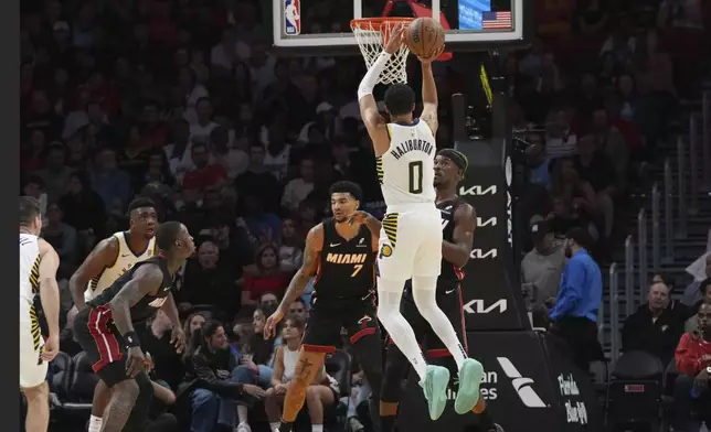 Indiana Pacers guard Tyrese Haliburton (0) shoots during the first half of an NBA basketball game against the Miami Heat Thursday, Jan. 2, 2025, in Miami. (AP Photo/Lynne Sladky)