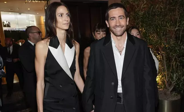 Jeanne Cadieu, left, and Jake Gyllenhaal arrive at the 82nd Golden Globes on Sunday, Jan. 5, 2025, at the Beverly Hilton in Beverly Hills, Calif. (AP Photo/Chris Pizzello)