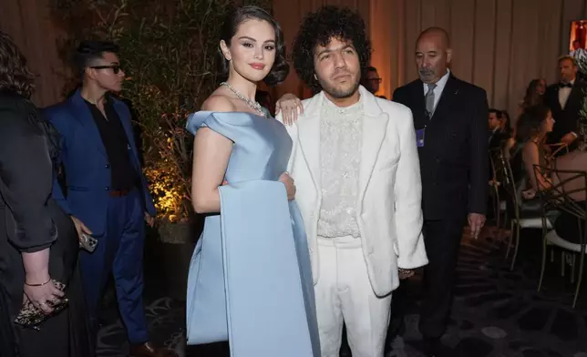 Selena Gomez, left, and Benny Blanco arrive at the 82nd Golden Globes on Sunday, Jan. 5, 2025, at the Beverly Hilton in Beverly Hills, Calif. (AP Photo/Chris Pizzello)