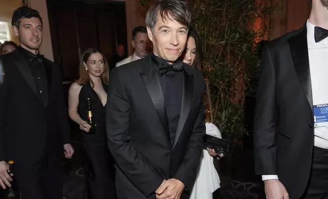 Sean Baker arrives at the 82nd Golden Globes on Sunday, Jan. 5, 2025, at the Beverly Hilton in Beverly Hills, Calif. (AP Photo/Chris Pizzello)