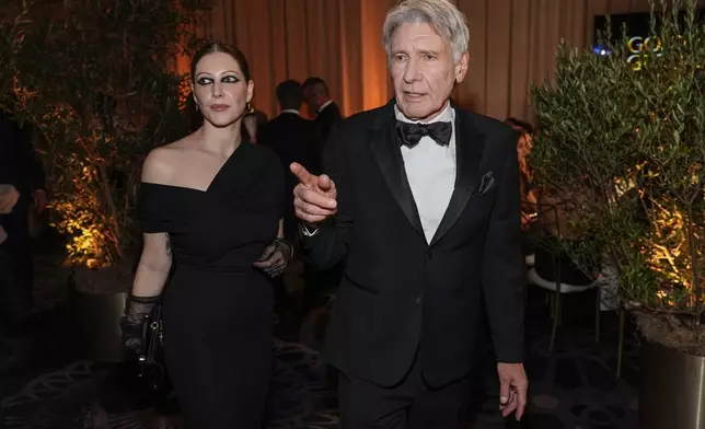 Georgia Ford, left, and Harrison Ford arrive at the 82nd Golden Globes on Sunday, Jan. 5, 2025, at the Beverly Hilton in Beverly Hills, Calif. (AP Photo/Chris Pizzello)