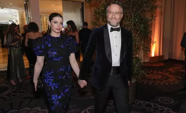 Lauren Miller, left and Seth Rogen arrive at the 82nd Golden Globes on Sunday, Jan. 5, 2025, at the Beverly Hilton in Beverly Hills, Calif. (AP Photo/Chris Pizzello)