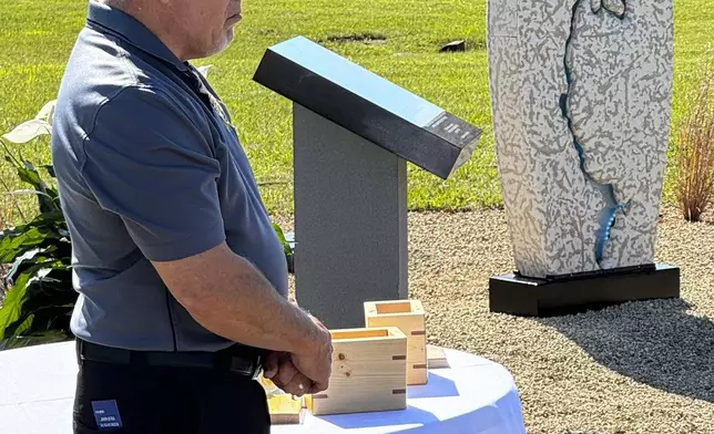 Hamilton County Coroner Jeff Jellison stands on August 29, 2024, in Westfield, Indiana, during the dedication of a memorial honoring suspected serial killer Herbert Baumeister's nine known victims. (AP Photo/Rick Callahan)