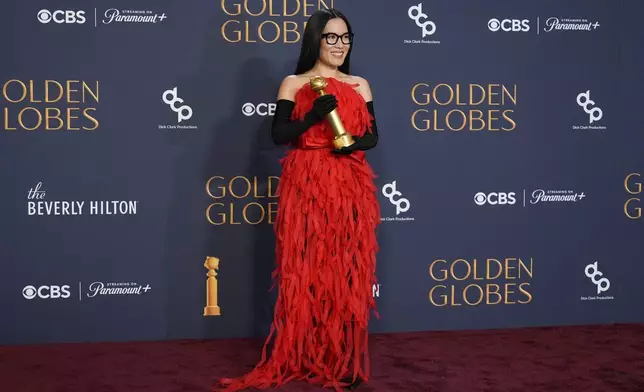 Ali Wong poses in the press room with the award for best performance in stand-up comedy on television for "Ali Wong: Single Lady" during the 82nd Golden Globes on Sunday, Jan. 5, 2025, at the Beverly Hilton in Beverly Hills, Calif. (AP Photo/Chris Pizzello)