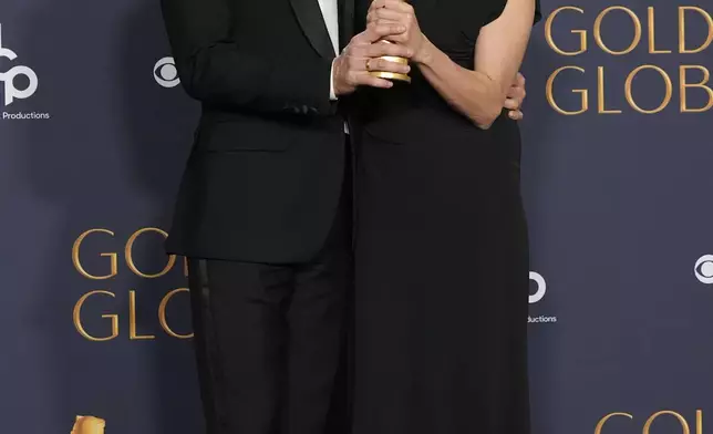 Clément Ducol, left, and Camille pose in the press room with the award for best original song - motion picture for "El Mal," from "Emilia Perez" in the press room during the 82nd Golden Globes on Sunday, Jan. 5, 2025, at the Beverly Hilton in Beverly Hills, Calif. (AP Photo/Chris Pizzello)