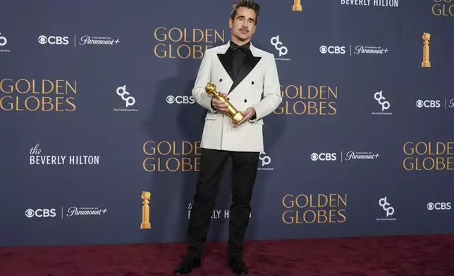 Colin Farrell poses in the press room with the award for best performance by a male actor in a limited series, anthology series, or a motion picture made for television for "The Penguin" during the 82nd Golden Globes on Sunday, Jan. 5, 2025, at the Beverly Hilton in Beverly Hills, Calif. (AP Photo/Chris Pizzello)